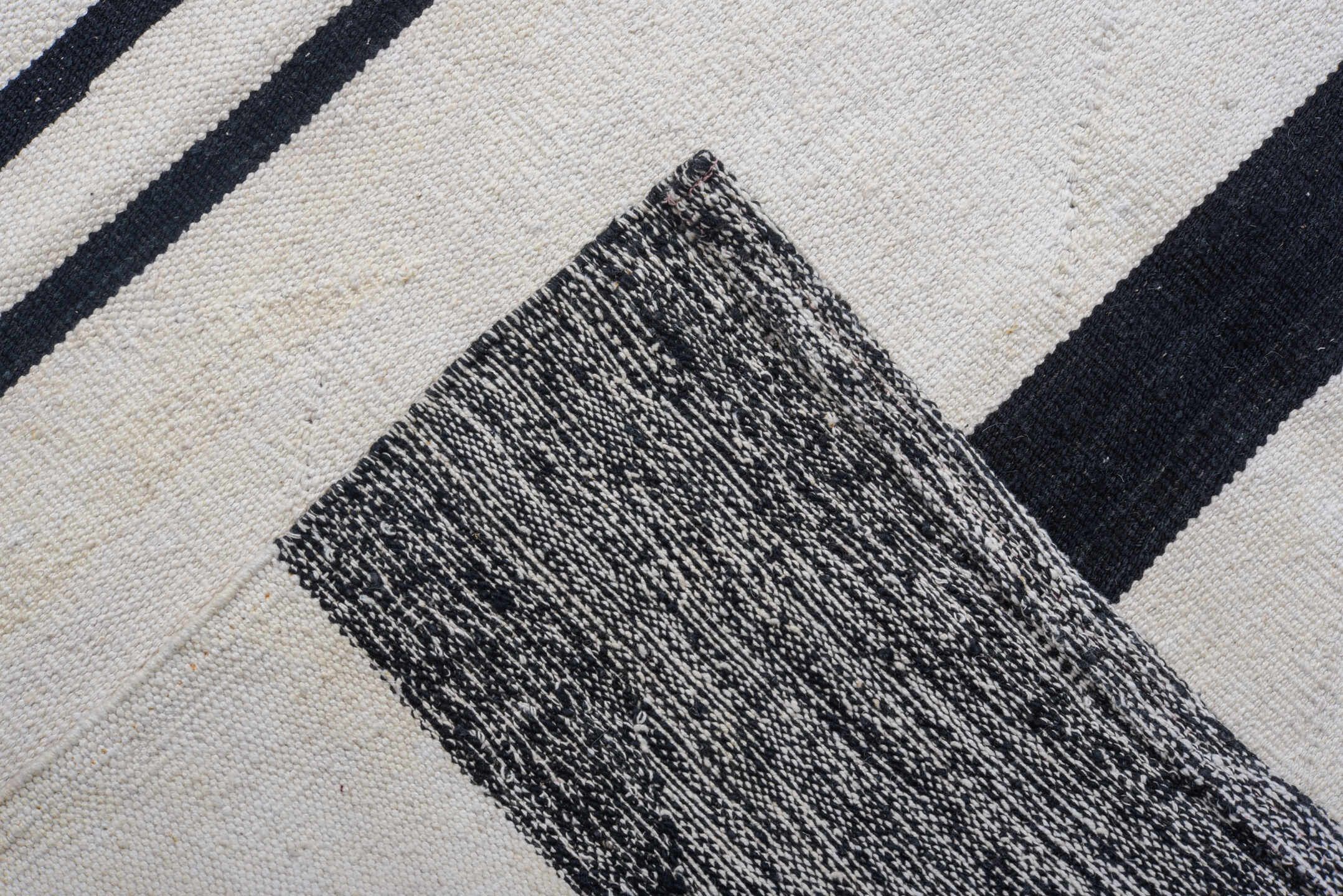 11' x 15' one-of-a-kind handmade vintage Tulu oversize rug. Color palette: ivory, charcoal, black, gray
