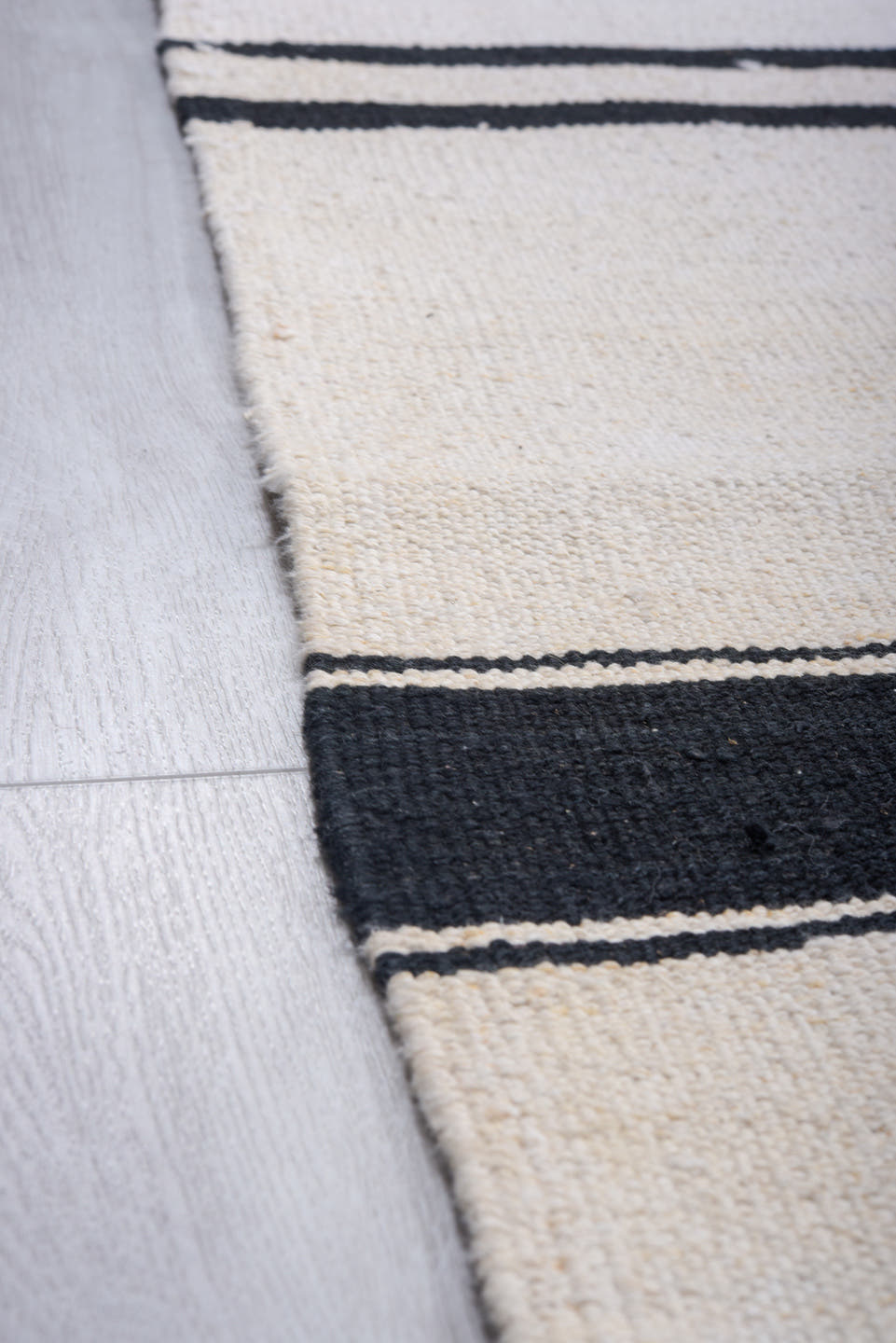 11' x 15' one-of-a-kind handmade vintage Tulu oversize rug. Color palette: ivory, charcoal, black, gray