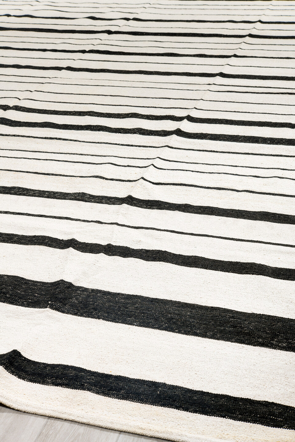 14' x 18' one-of-a-kind handmade vintage Tulu oversize rug. Color palette: ivory, charcoal, gray, black