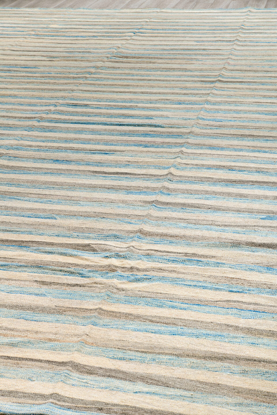 14' x 19' one-of-a-kind handmade vintage Tulu oversize rug. Color palette: ivory, pale blue, taupe, cream, gray, light blue