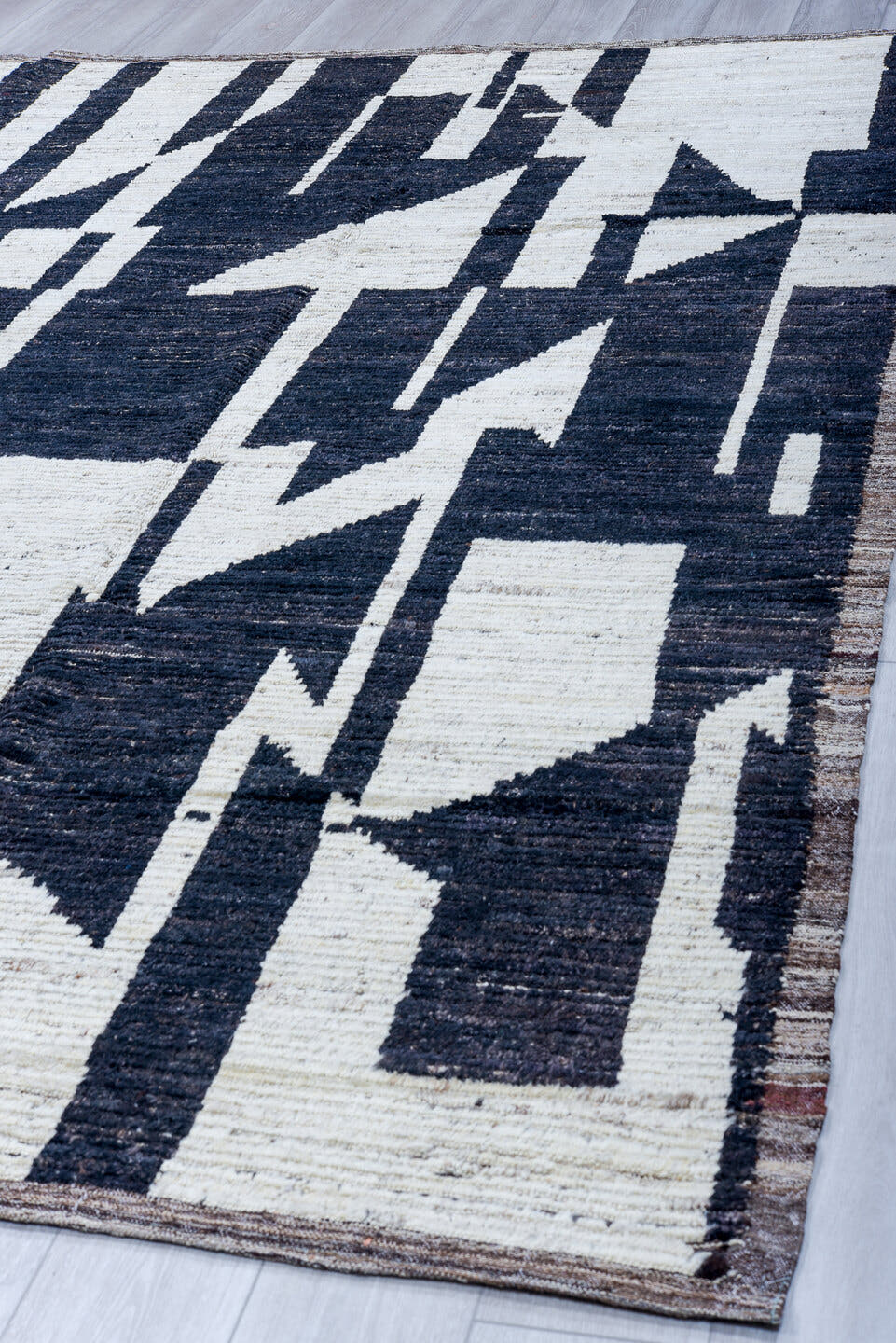 9' x 11' one-of-a-kind handmade vintage Tulu large size rug. Color palette: ivory, charcoal, slate, taupe, gray, black
