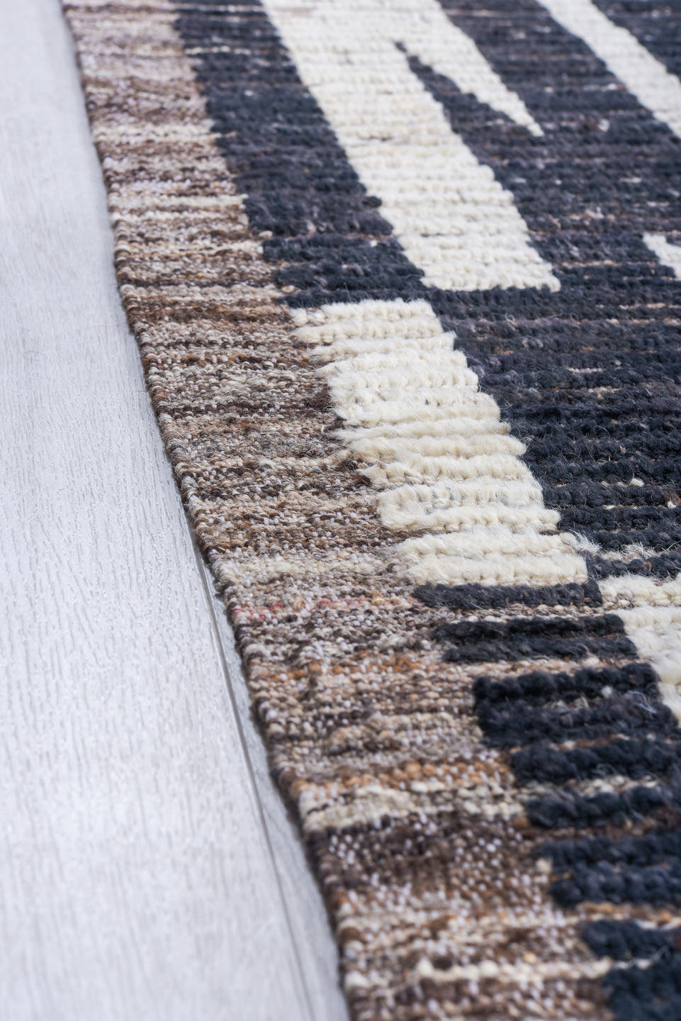 9' x 11' one-of-a-kind handmade vintage Tulu large size rug. Color palette: ivory, charcoal, slate, taupe, gray, black