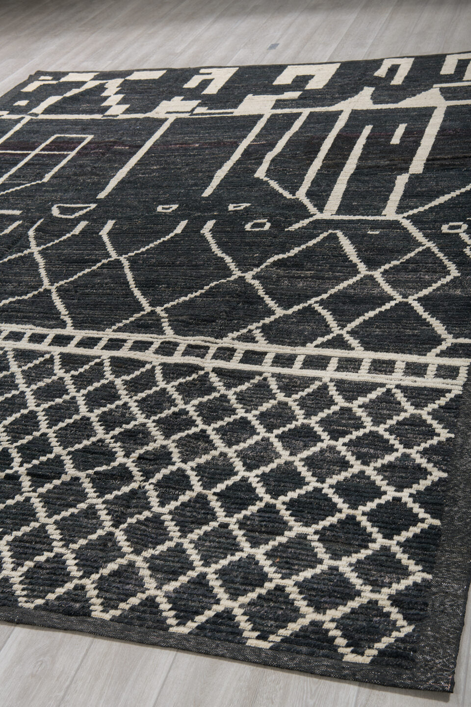 9' x 12' one-of-a-kind handmade vintage Tulu large size rug. Color palette: charcoal, ivory, slate, ebony, gray, black