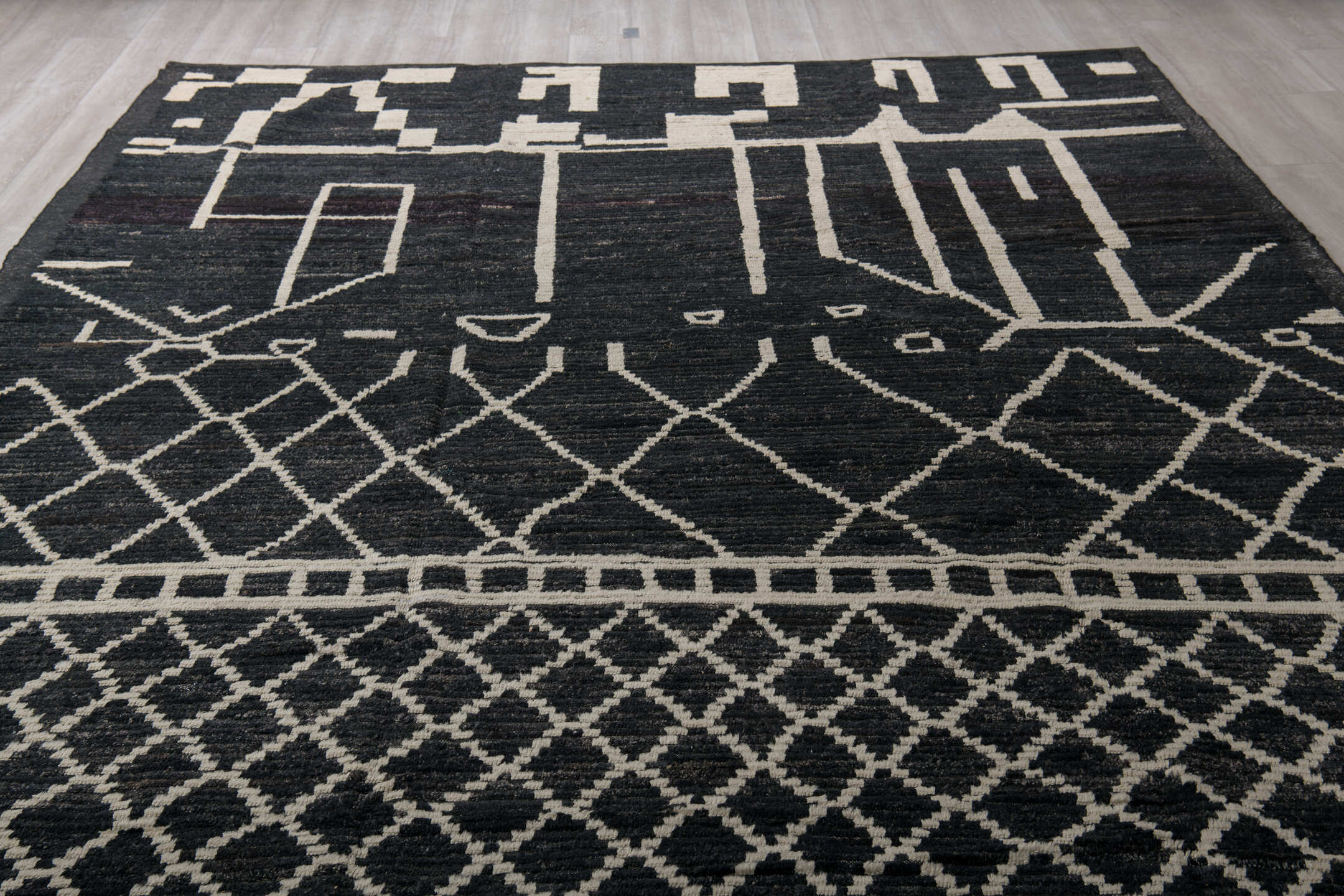 9' x 12' one-of-a-kind handmade vintage Tulu large size rug. Color palette: charcoal, ivory, slate, ebony, gray, black