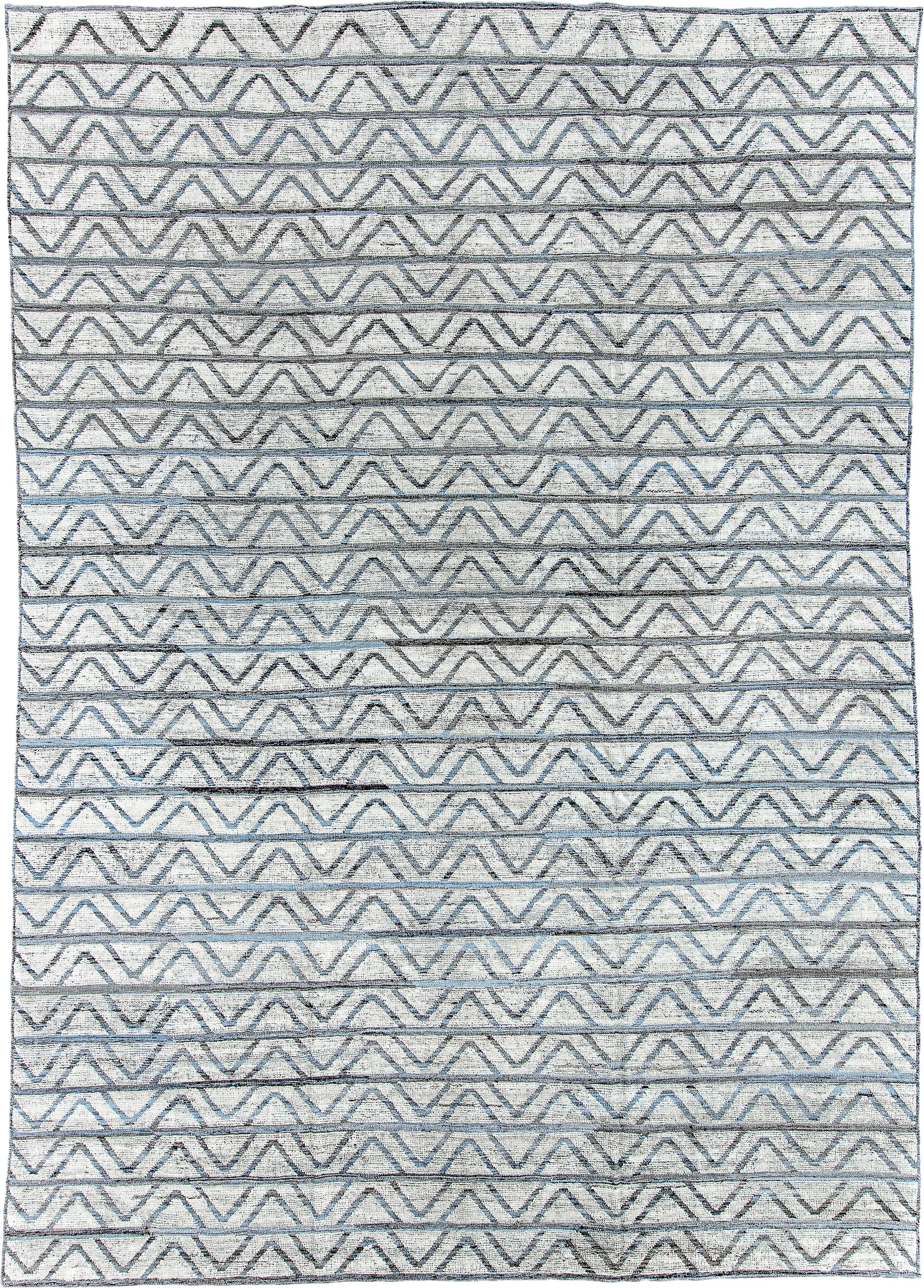 9' x 13' one-of-a-kind handmade vintage Tulu large size rug. Color palette: ivory, slate, blue, charcoal, gray, black