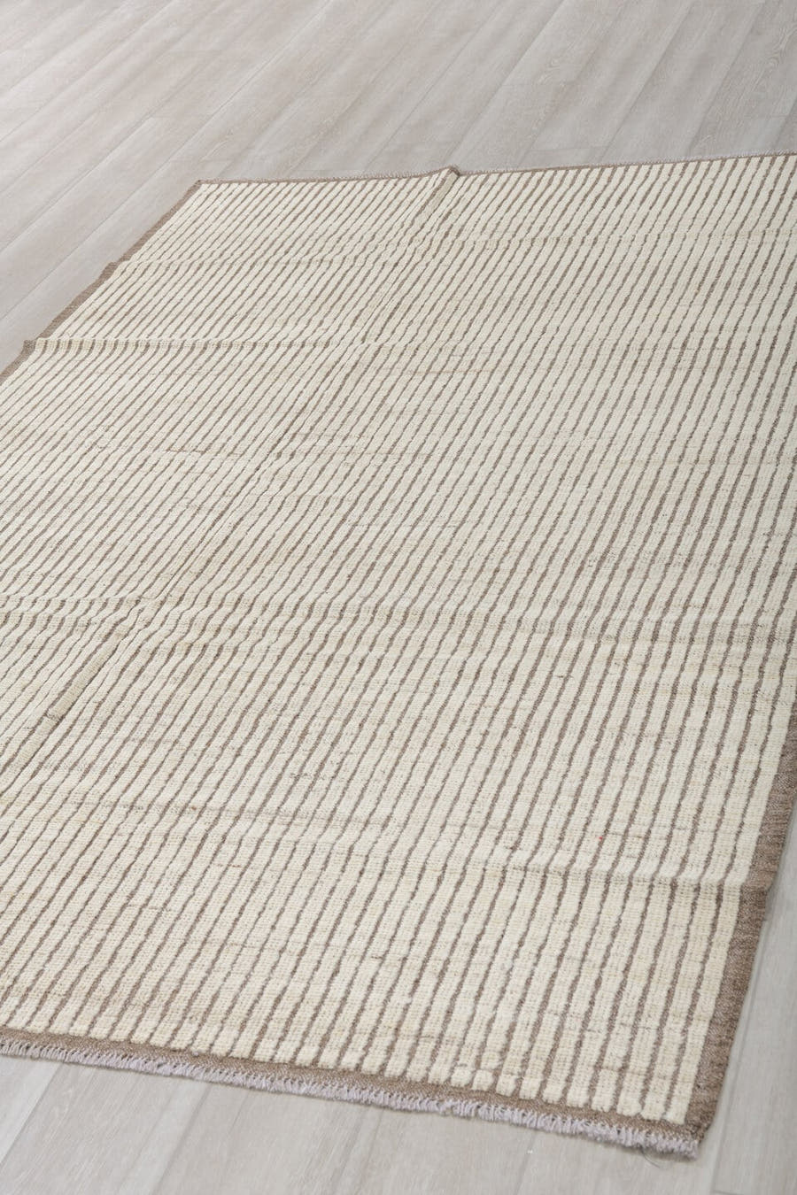 5' x 8' one-of-a-kind handmade vintage Tulu medium size rug. Color palette: ivory, taupe, brown, cream, beige, gray