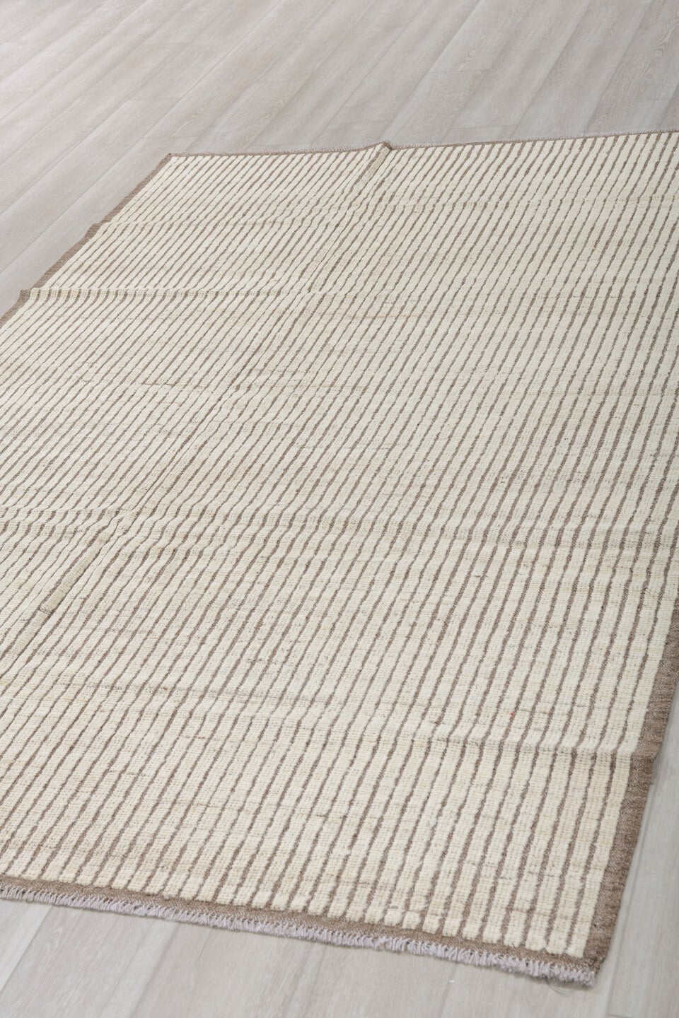 5' x 8' one-of-a-kind handmade vintage Tulu medium size rug. Color palette: ivory, taupe, brown, cream, beige, gray