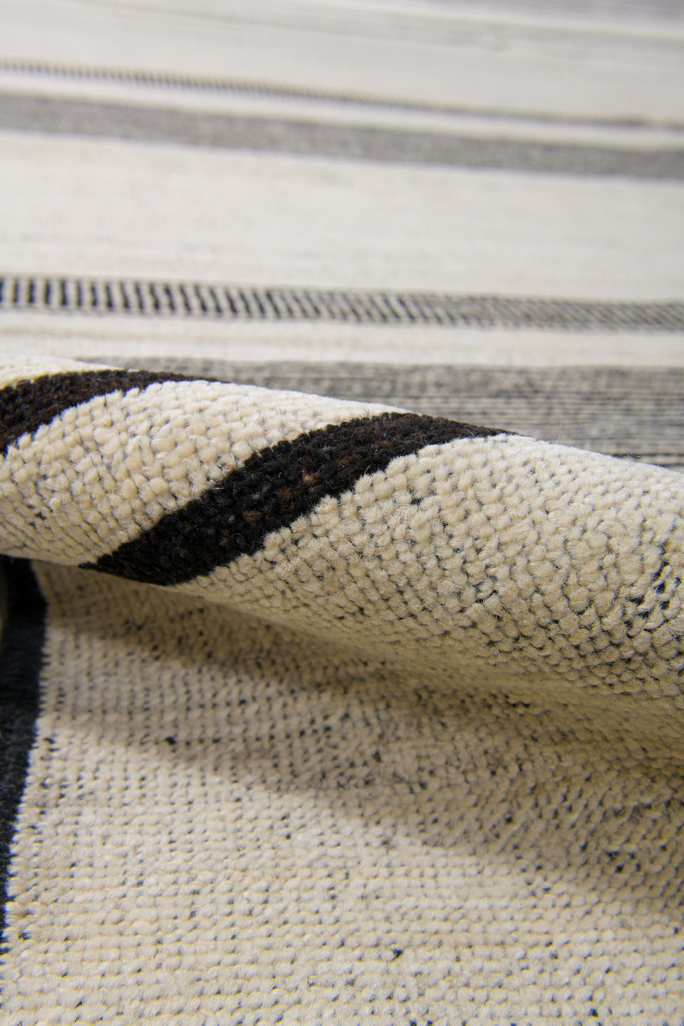 8' x 12' one-of-a-kind handmade vintage Tulu large size rug. Color palette: ivory, charcoal, cream, taupe, black, gray