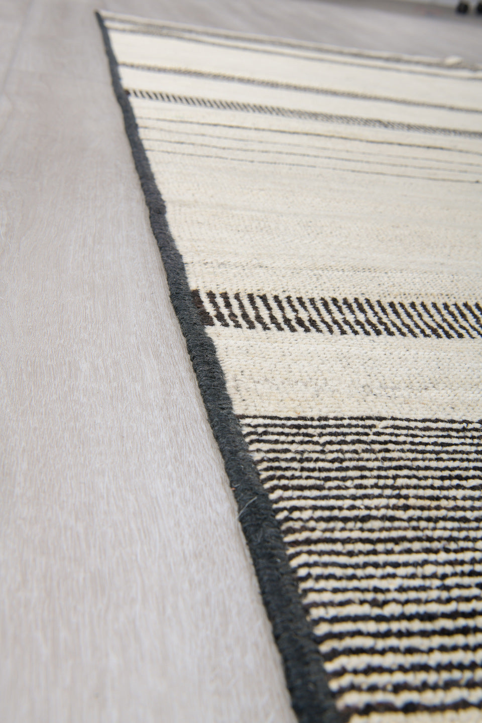 8' x 12' one-of-a-kind handmade vintage Tulu large size rug. Color palette: ivory, charcoal, cream, taupe, black, gray