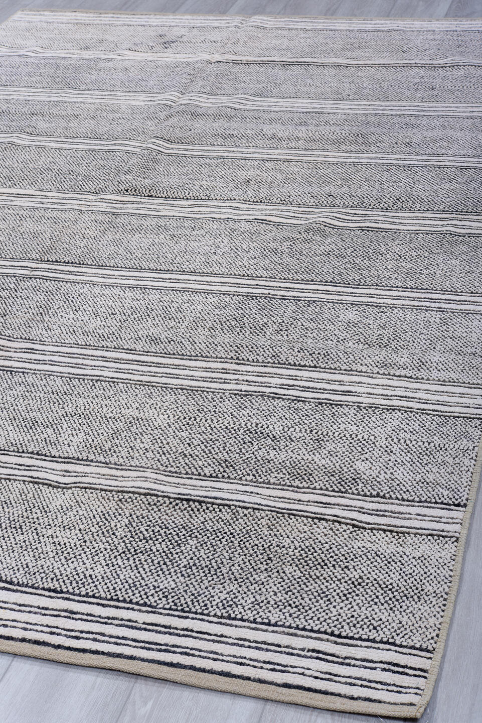 6' x 9' one-of-a-kind handmade vintage Tulu medium size rug. Color palette: ivory, charcoal, gray, black