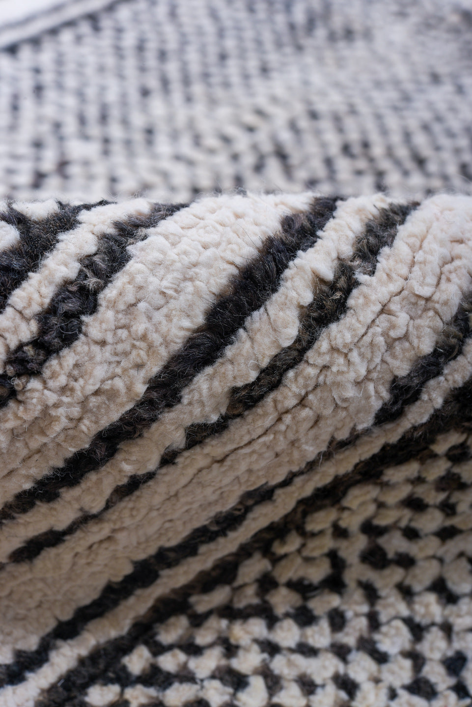 6' x 9' one-of-a-kind handmade vintage Tulu medium size rug. Color palette: ivory, charcoal, gray, black