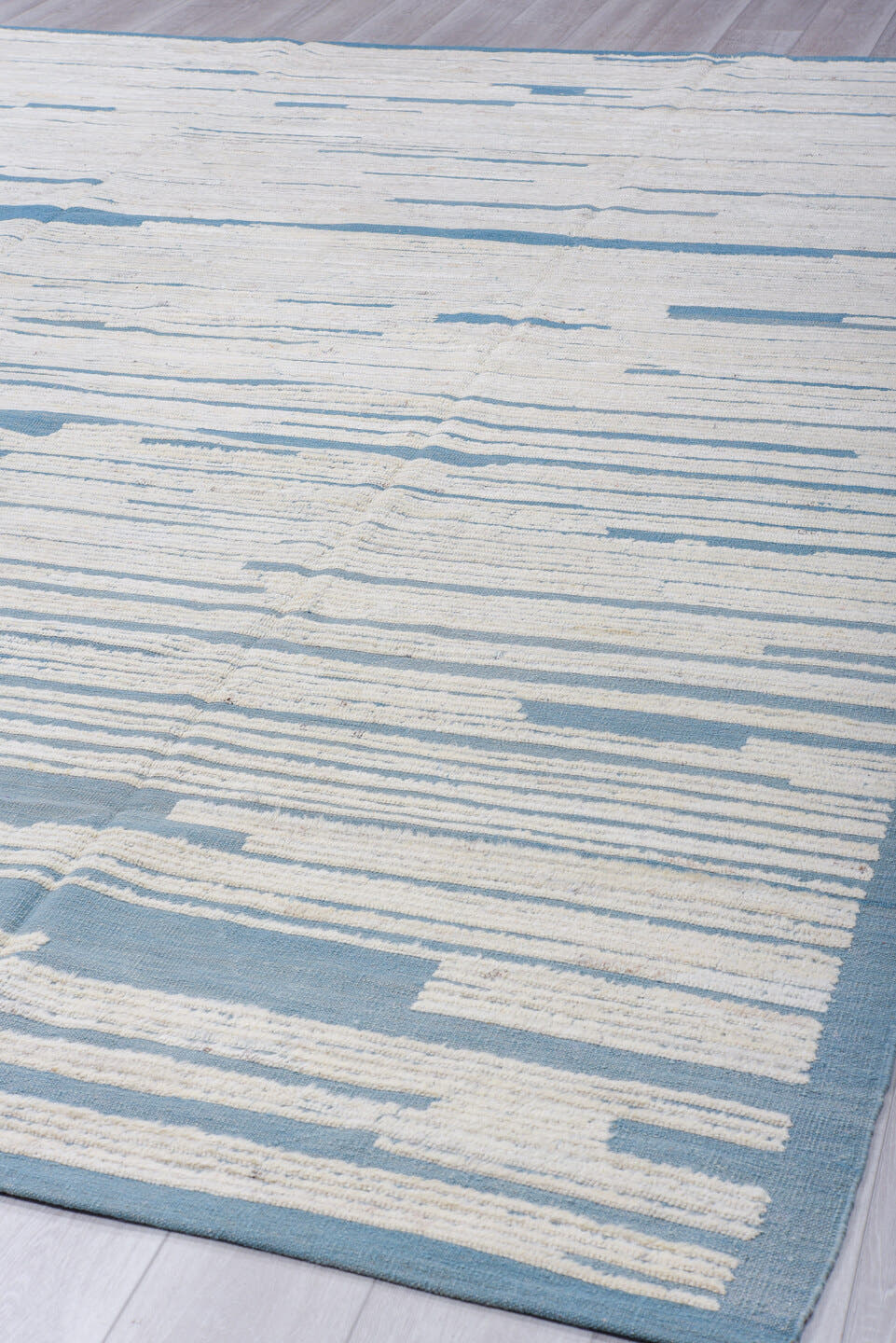 9' x 12' one-of-a-kind handmade vintage Tulu large size rug. Color palette: ivory, sky blue, slate, light blue, gray