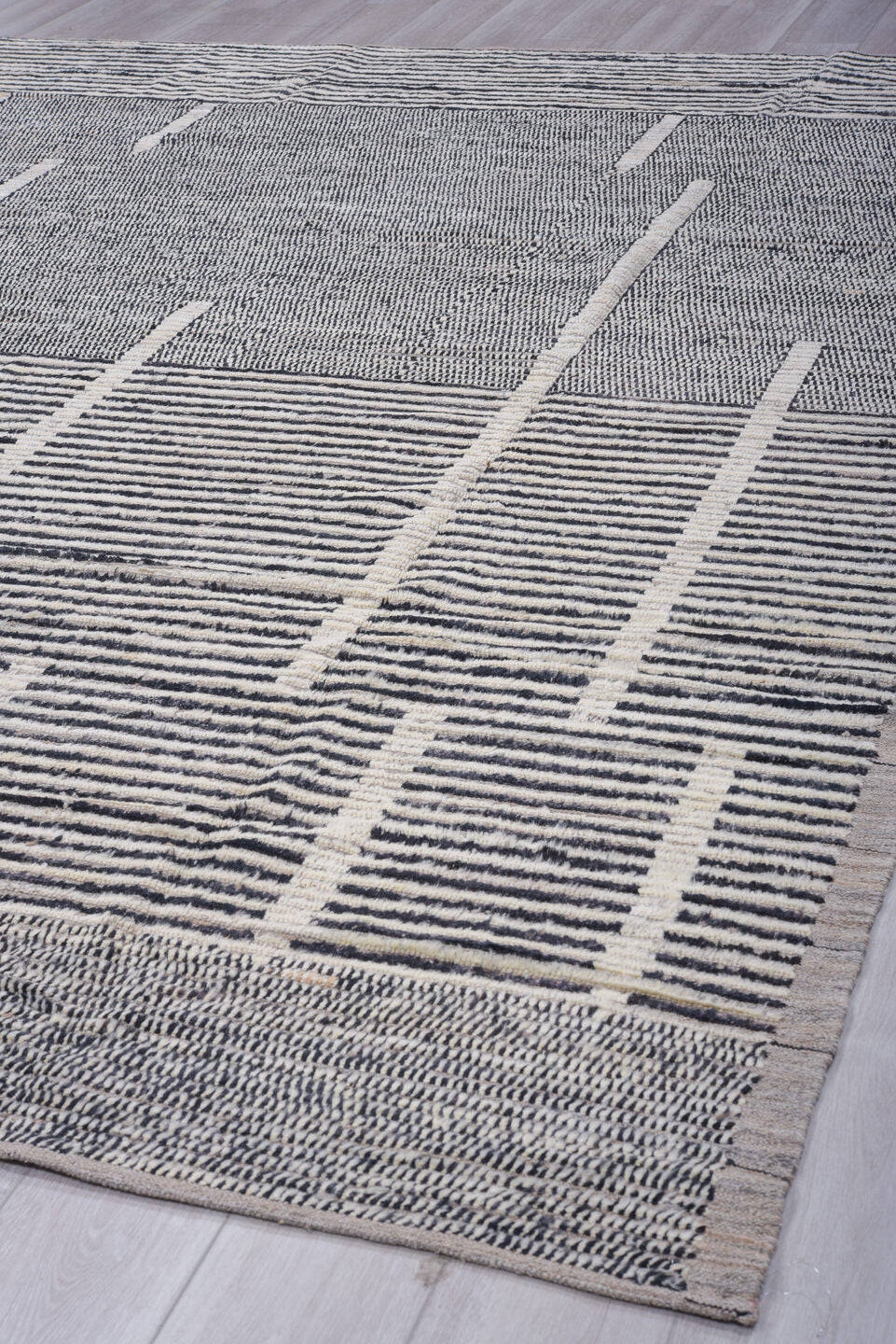9' x 12' one-of-a-kind handmade vintage Tulu large size rug. Color palette: charcoal, ivory, gray, black