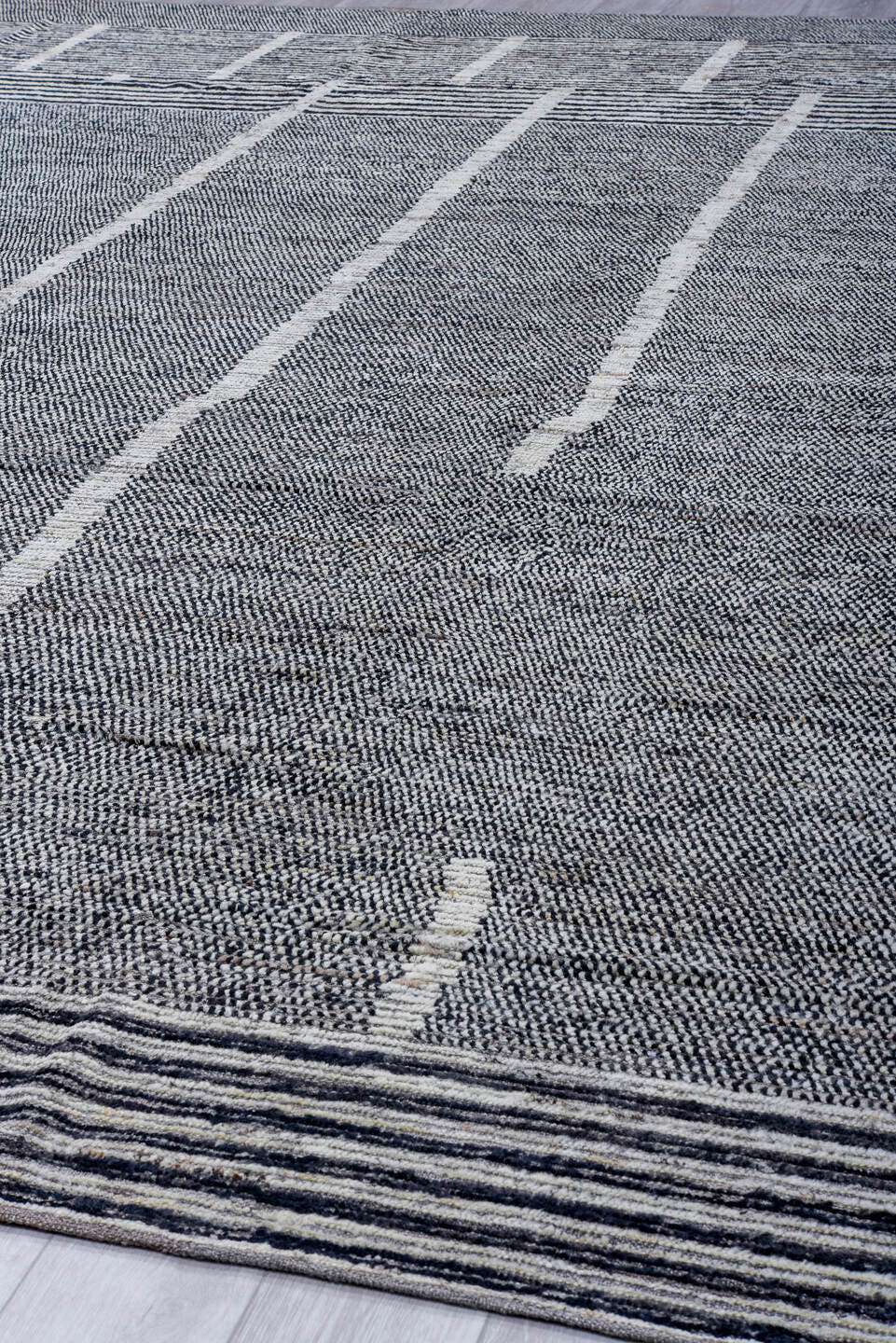 13' x 15' one-of-a-kind handmade vintage Tulu oversize rug. Color palette: gray, charcoal, ivory, slate, black