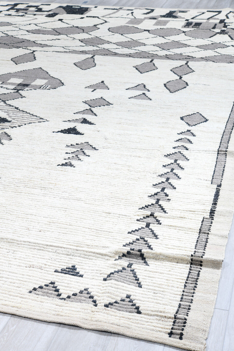 13' x 16' one-of-a-kind handmade vintage Tulu oversize rug. Color palette: ivory, gray, charcoal, black