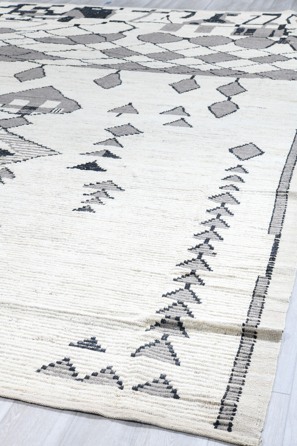 13' x 16' one-of-a-kind handmade vintage Tulu oversize rug. Color palette: ivory, gray, charcoal, black