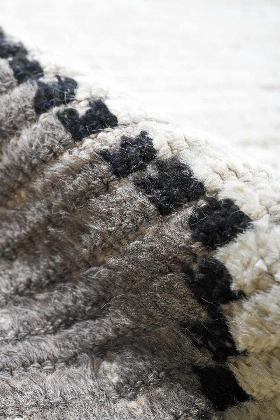 13' x 16' one-of-a-kind handmade vintage Tulu oversize rug. Color palette: ivory, gray, charcoal, black