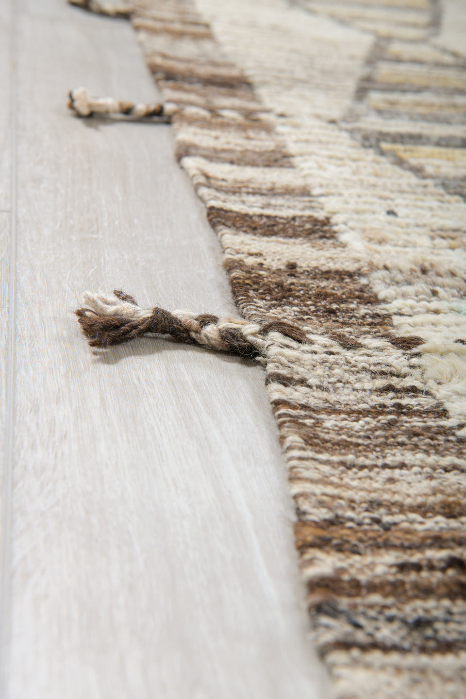 13' x 16' one-of-a-kind handmade vintage Tulu oversize rug. Color palette: ivory, taupe, brown, pale gold, charcoal, beige