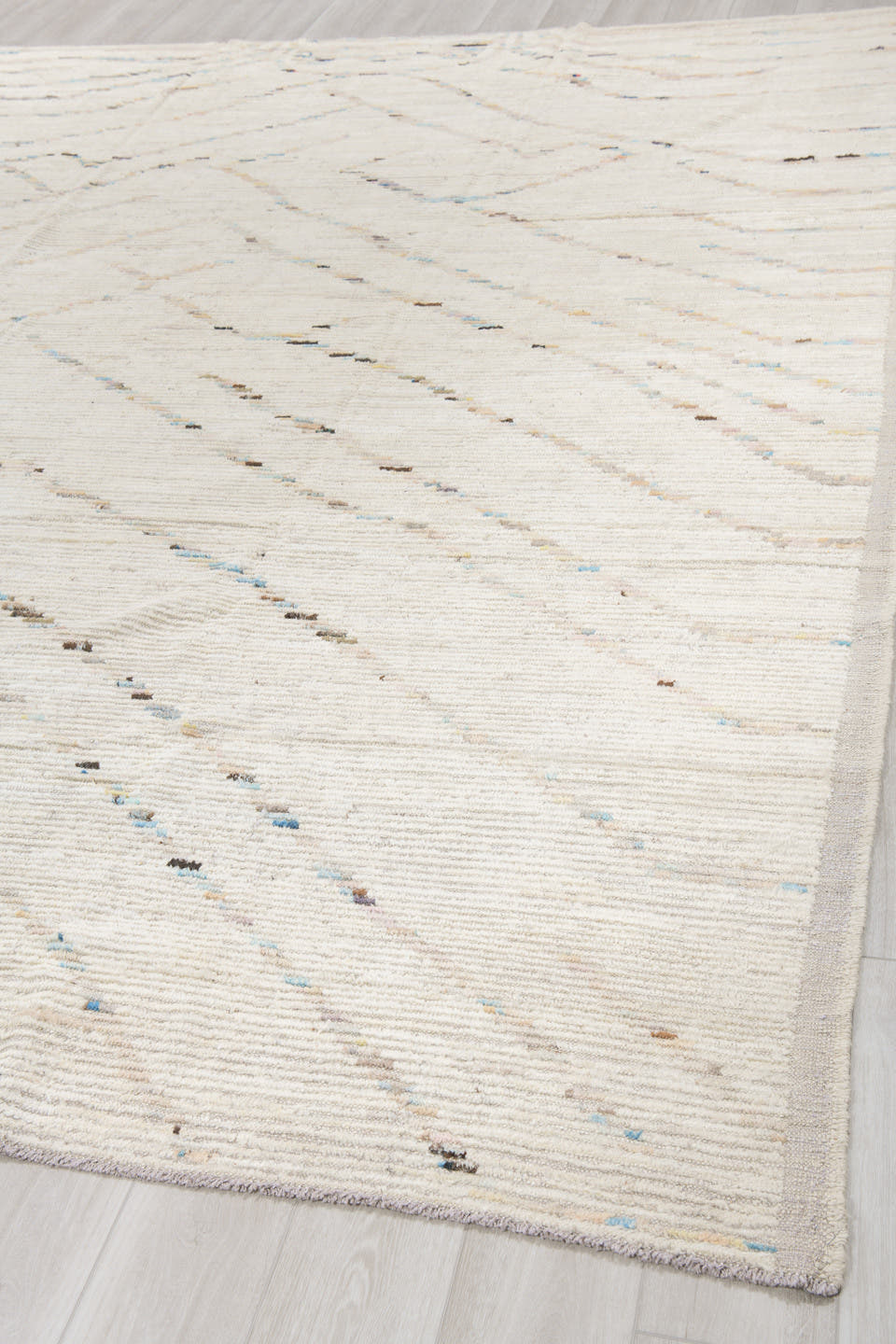 10' x 13' one-of-a-kind handmade vintage Tulu large size rug. Color palette: ivory, cream, charcoal, pale blue, taupe, beige
