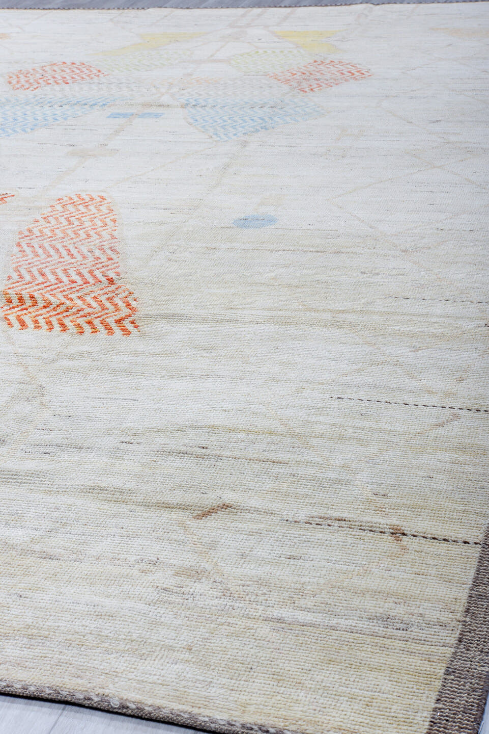 10' x 14' one-of-a-kind handmade vintage Tulu large size rug. Color palette: ivory, taupe, apricot, pale blue, butter yellow