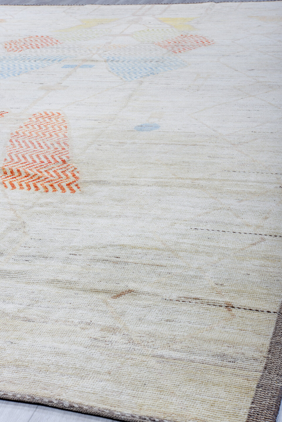 10' x 14' one-of-a-kind handmade vintage Tulu large size rug. Color palette: ivory, taupe, apricot, pale blue, butter yellow