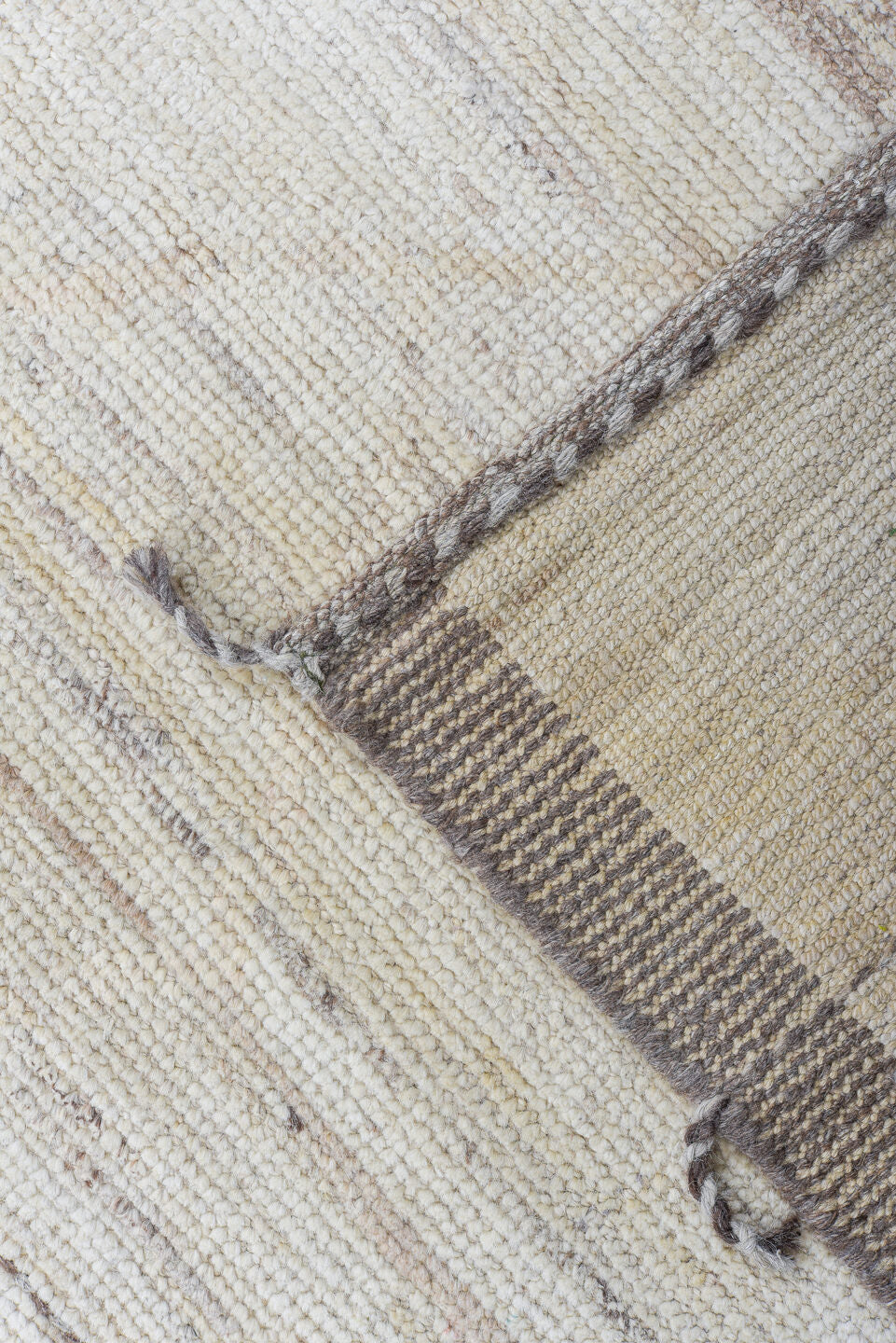 10' x 14' one-of-a-kind handmade vintage Tulu large size rug. Color palette: ivory, taupe, apricot, pale blue, butter yellow