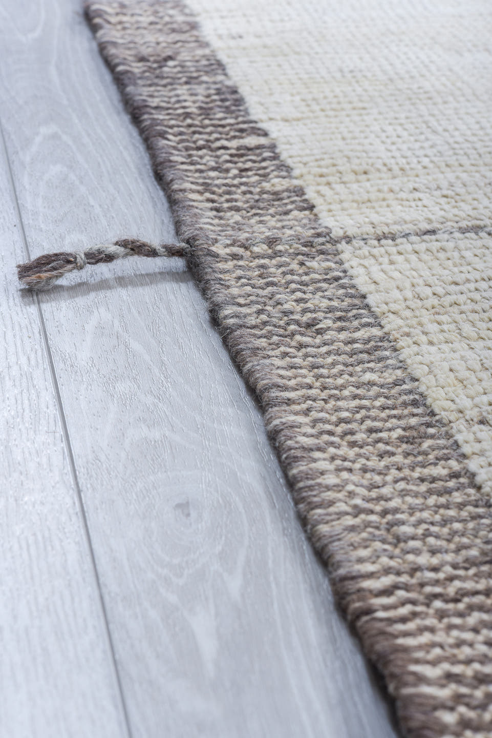 10' x 14' one-of-a-kind handmade vintage Tulu large size rug. Color palette: ivory, taupe, apricot, pale blue, butter yellow