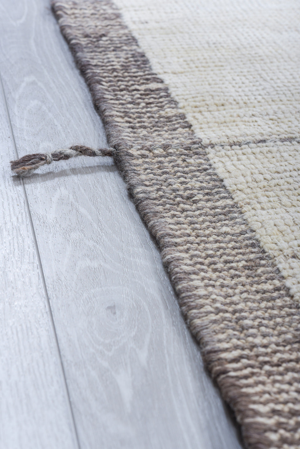 10' x 14' one-of-a-kind handmade vintage Tulu large size rug. Color palette: ivory, taupe, apricot, pale blue, butter yellow