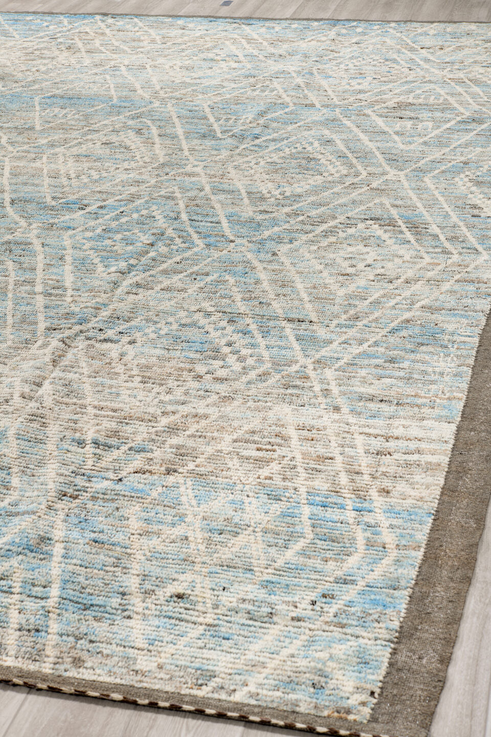 9' x 14' one-of-a-kind handmade vintage Tulu large size rug. Color palette: ivory, ice blue, taupe, silver gray, pale blue