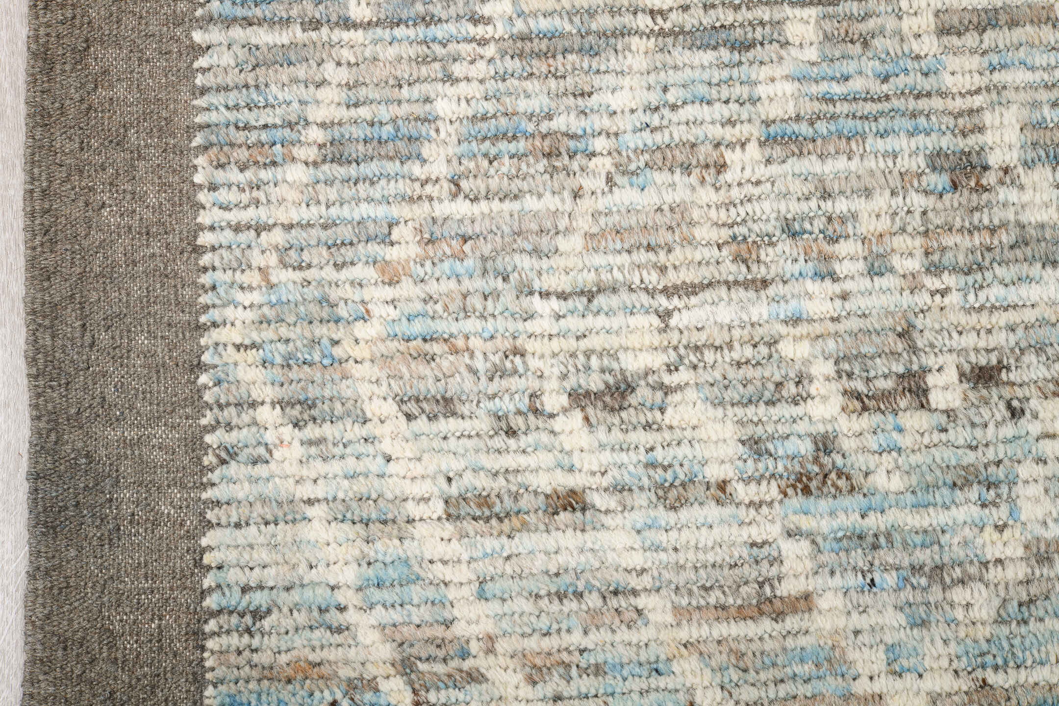 9' x 14' one-of-a-kind handmade vintage Tulu large size rug. Color palette: ivory, ice blue, taupe, silver gray, pale blue
