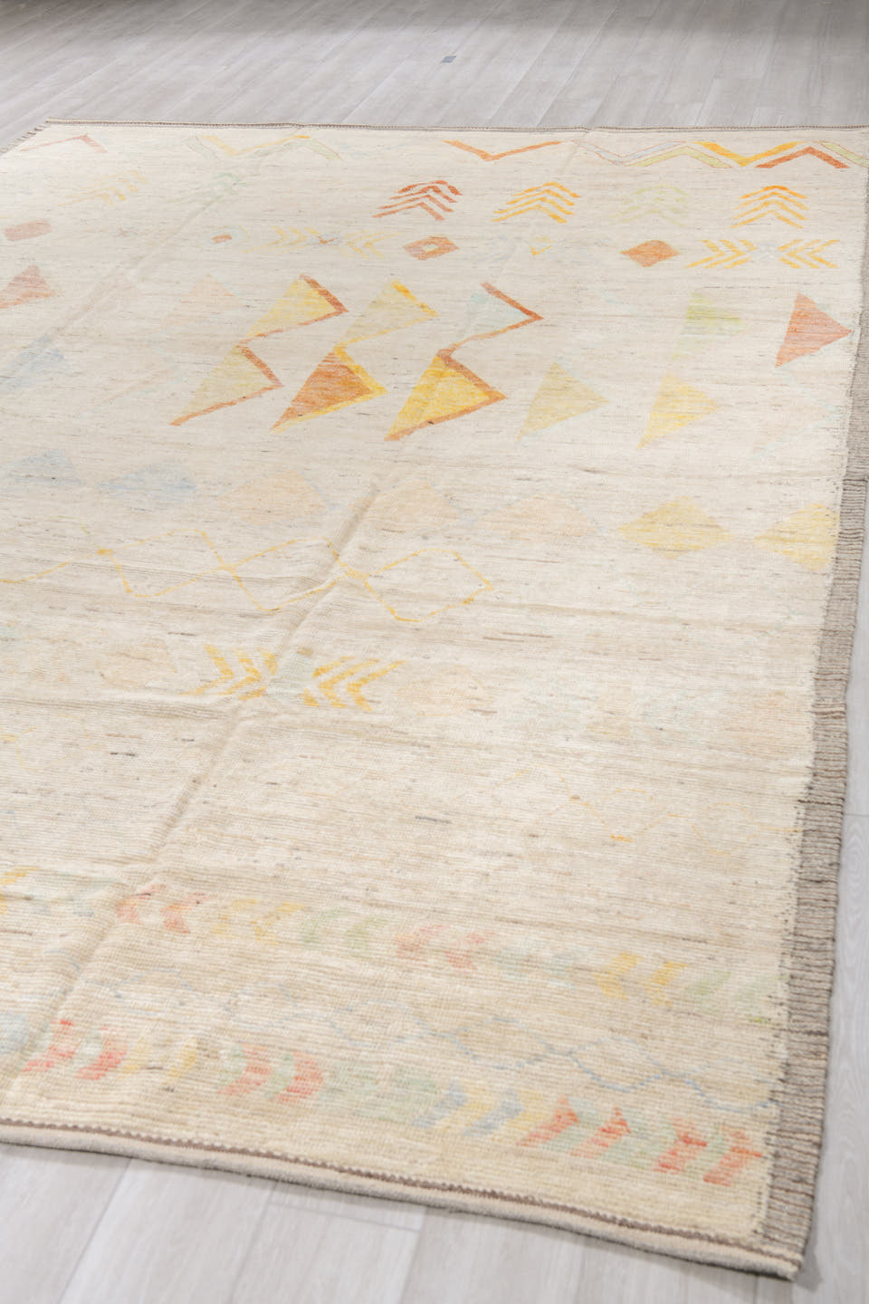 10' x 14' one-of-a-kind handmade vintage Tulu large size rug. Color palette: ivory, cream, saffron, rust, pale blue, blush