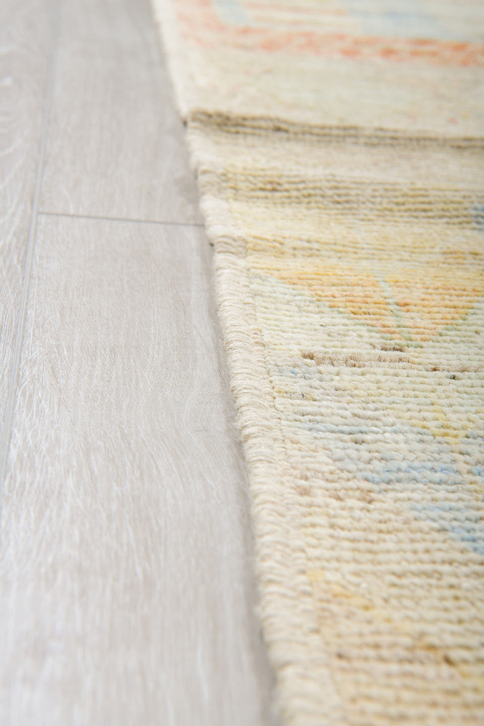 13' x 19' one-of-a-kind handmade vintage Tulu oversize rug. Color palette: ivory, cream, pale blue, blush, soft yellow