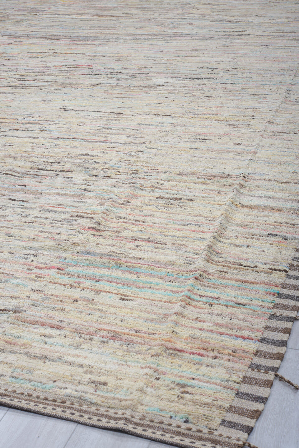 10' x 13' one-of-a-kind handmade vintage Tulu large size rug. Color palette: ivory, taupe, charcoal, cream, pale blue, coral