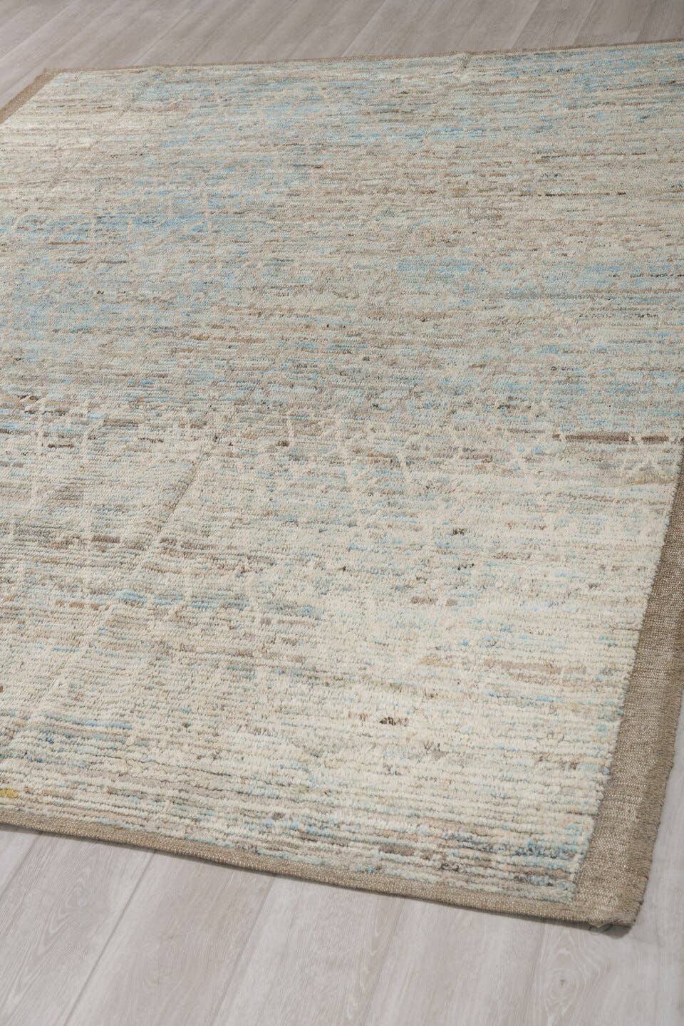 7' x 10' one-of-a-kind handmade vintage Tulu large size rug. Color palette: ivory, taupe, beige, pale blue, brown, cream