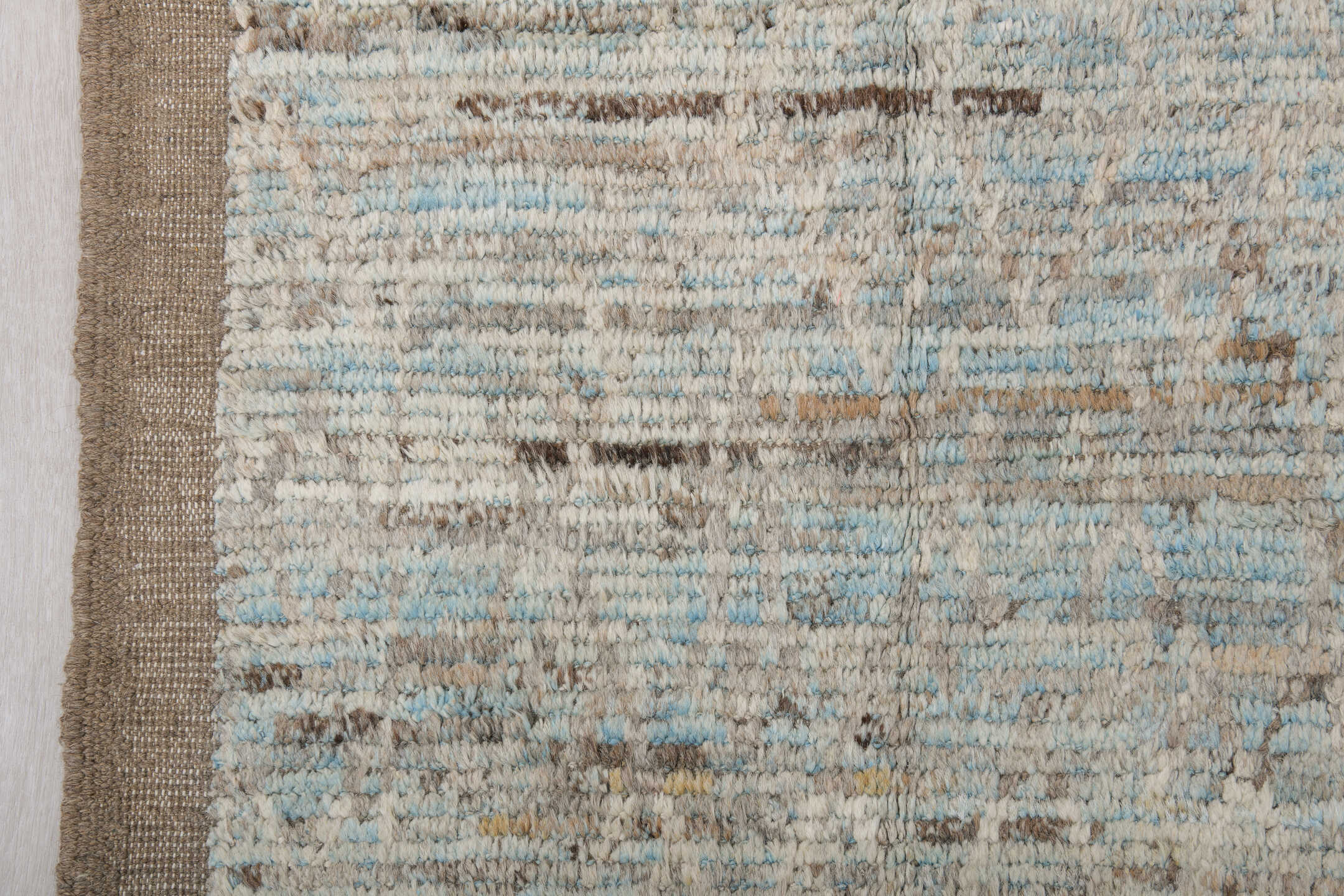 7' x 10' one-of-a-kind handmade vintage Tulu large size rug. Color palette: ivory, taupe, beige, pale blue, brown, cream