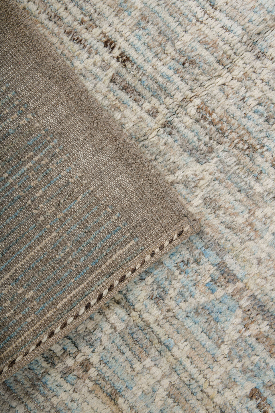 7' x 10' one-of-a-kind handmade vintage Tulu large size rug. Color palette: ivory, taupe, beige, pale blue, brown, cream