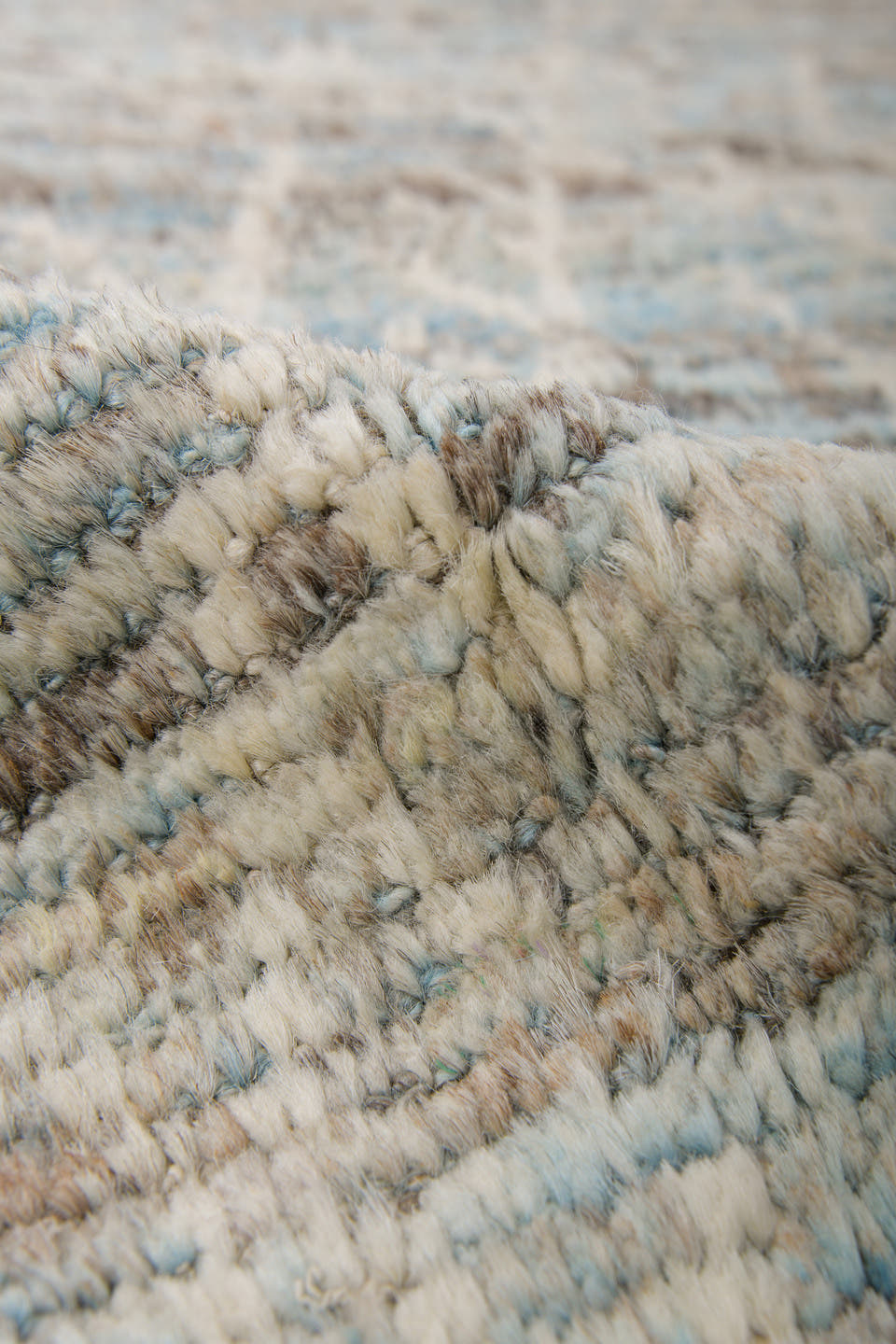 7' x 10' one-of-a-kind handmade vintage Tulu large size rug. Color palette: ivory, taupe, beige, pale blue, brown, cream