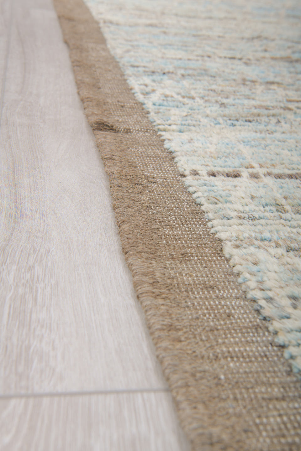7' x 10' one-of-a-kind handmade vintage Tulu large size rug. Color palette: ivory, taupe, beige, pale blue, brown, cream