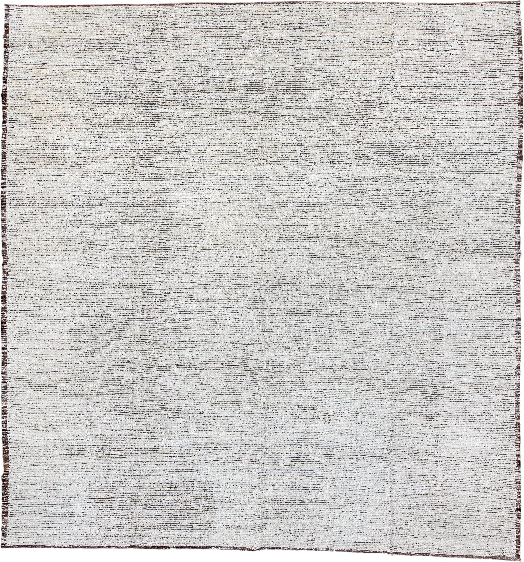 13' x 13' one-of-a-kind handmade vintage Tulu oversize rug. Color palette: ivory, charcoal, taupe, brown, gray, black, beige