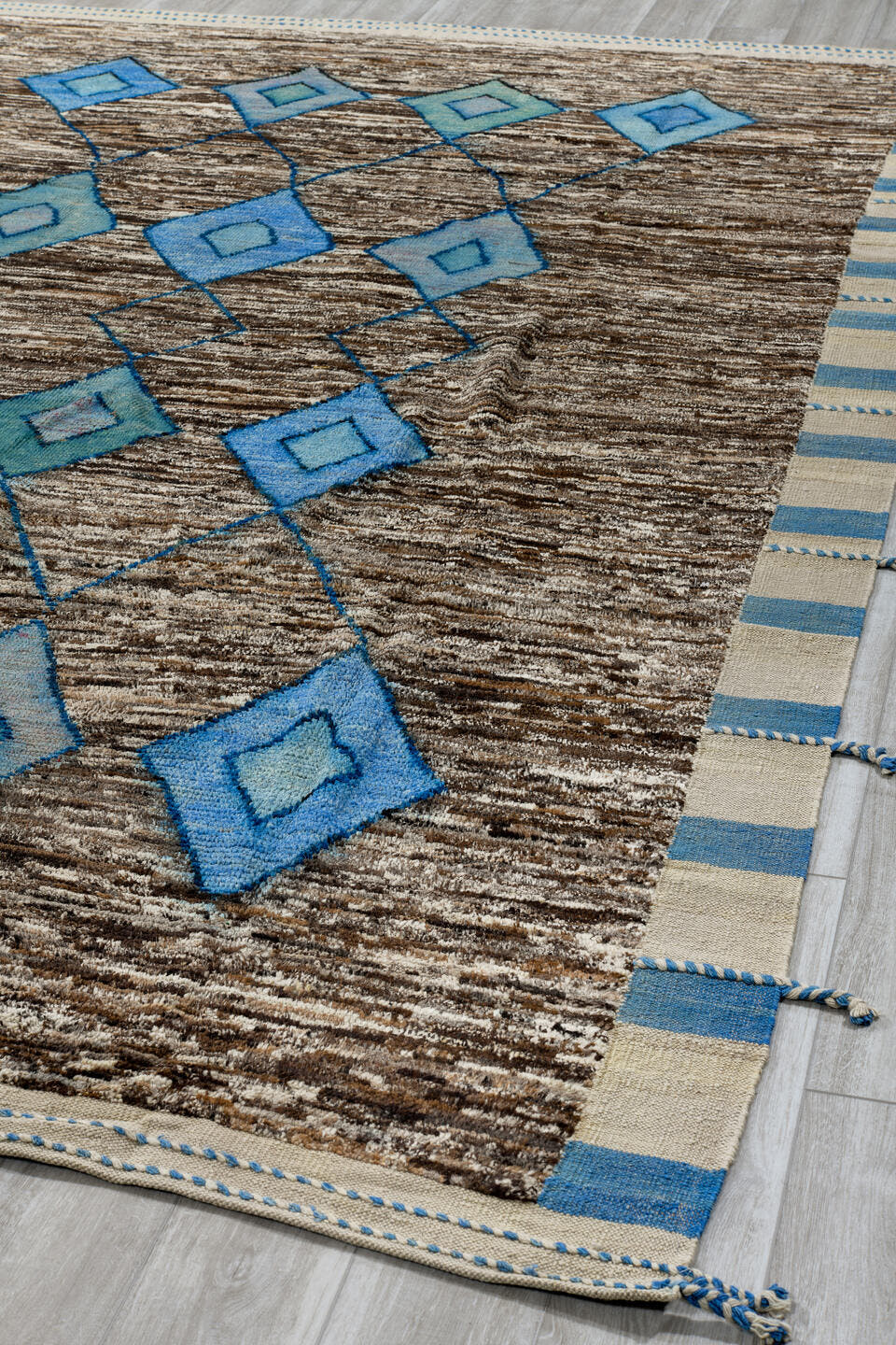 8' x 13' one-of-a-kind handmade vintage Tulu large size rug. Color palette: brown, ivory, sky blue, powder blue, camel