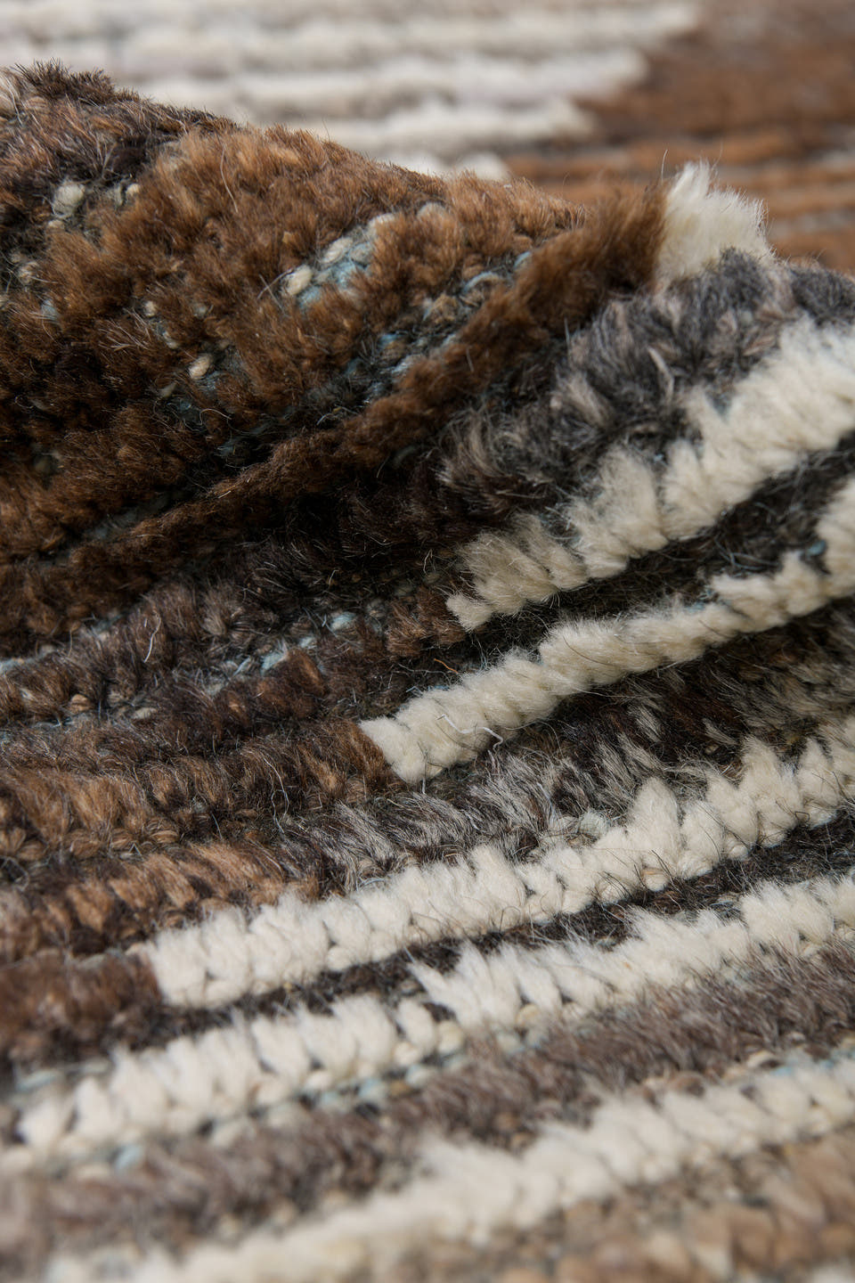 8' x 9' one-of-a-kind handmade vintage Tulu rug. Color palette: ivory, brown, taupe, charcoal, camel, beige, gray, black