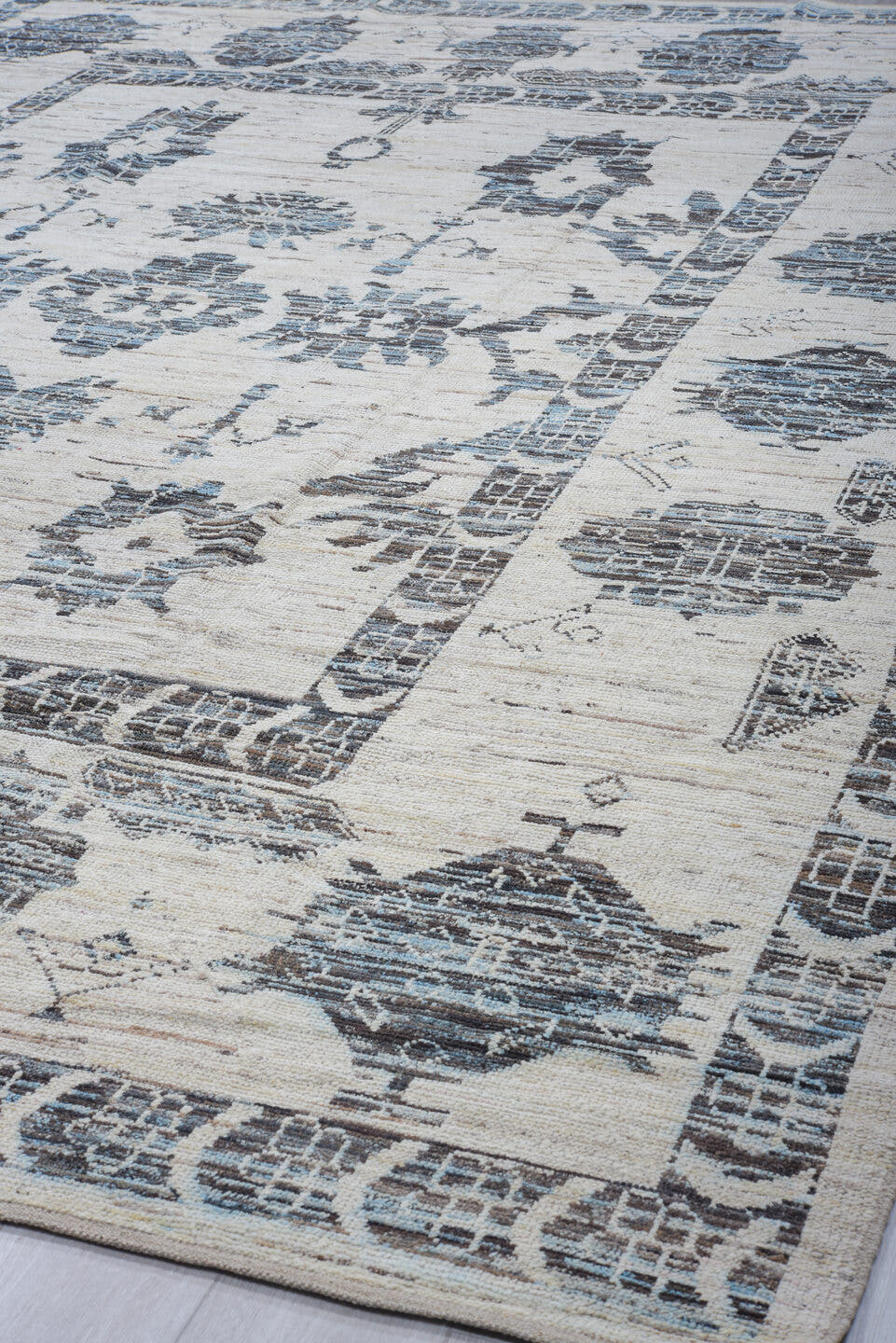 9' x 13' one-of-a-kind handmade vintage Tulu large size rug. Color palette: ivory, charcoal, pale blue, slate, cream, gray