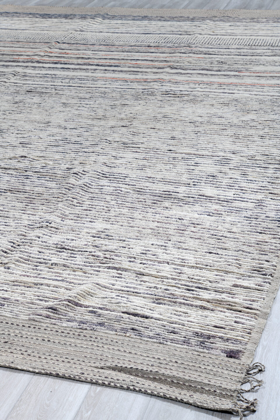 12' x 15' one-of-a-kind handmade vintage Tulu oversize rug. Color palette: ivory, charcoal, slate, rust, taupe, gray, black