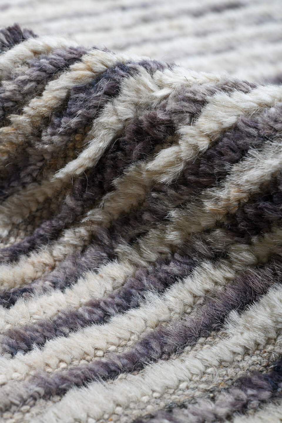 12' x 15' one-of-a-kind handmade vintage Tulu oversize rug. Color palette: ivory, charcoal, slate, rust, taupe, gray, black