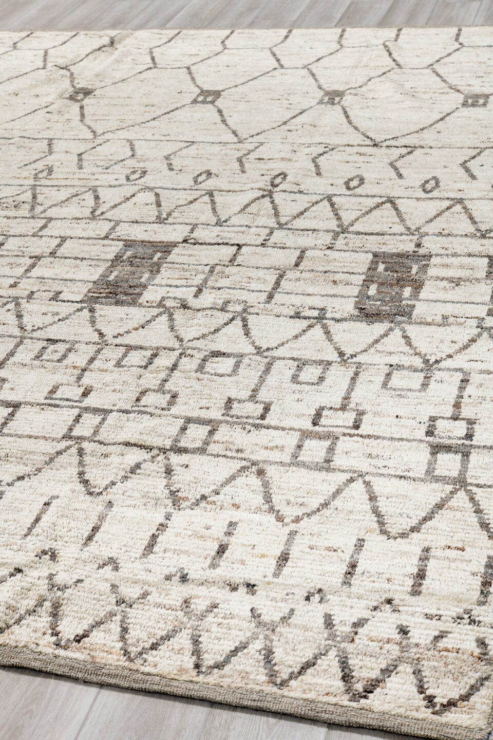 9' x 11' one-of-a-kind handmade vintage Tulu large size rug. Color palette: ivory, charcoal, taupe, cream, gray, black
