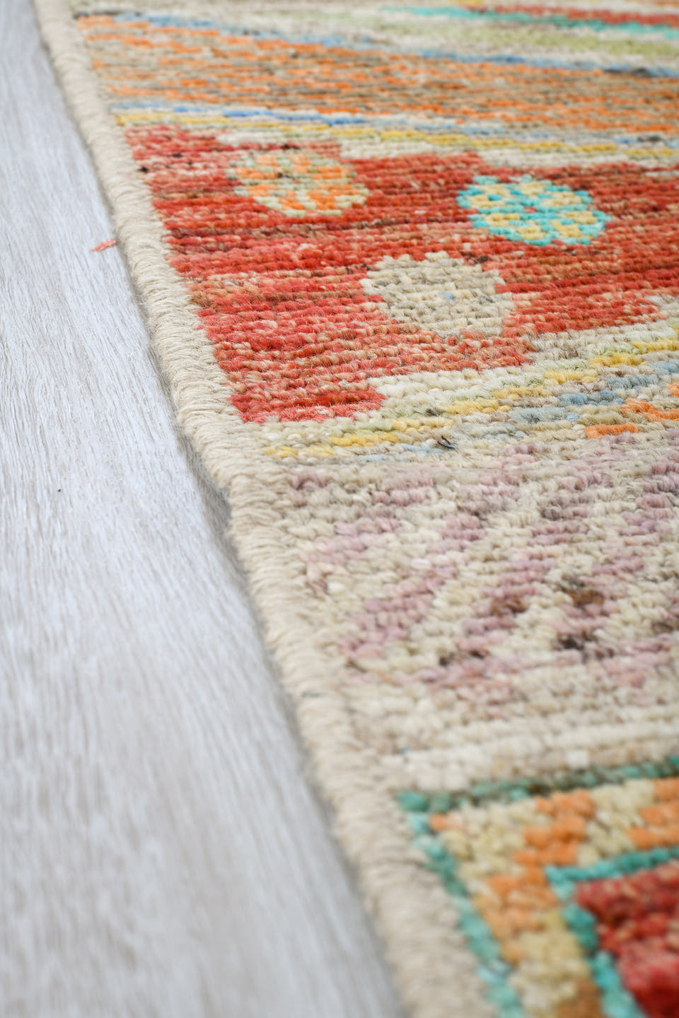 5' x 8' one-of-a-kind handmade vintage Tulu medium size rug. Color palette: ivory, coral, aqua, pale blue, sand, taupe