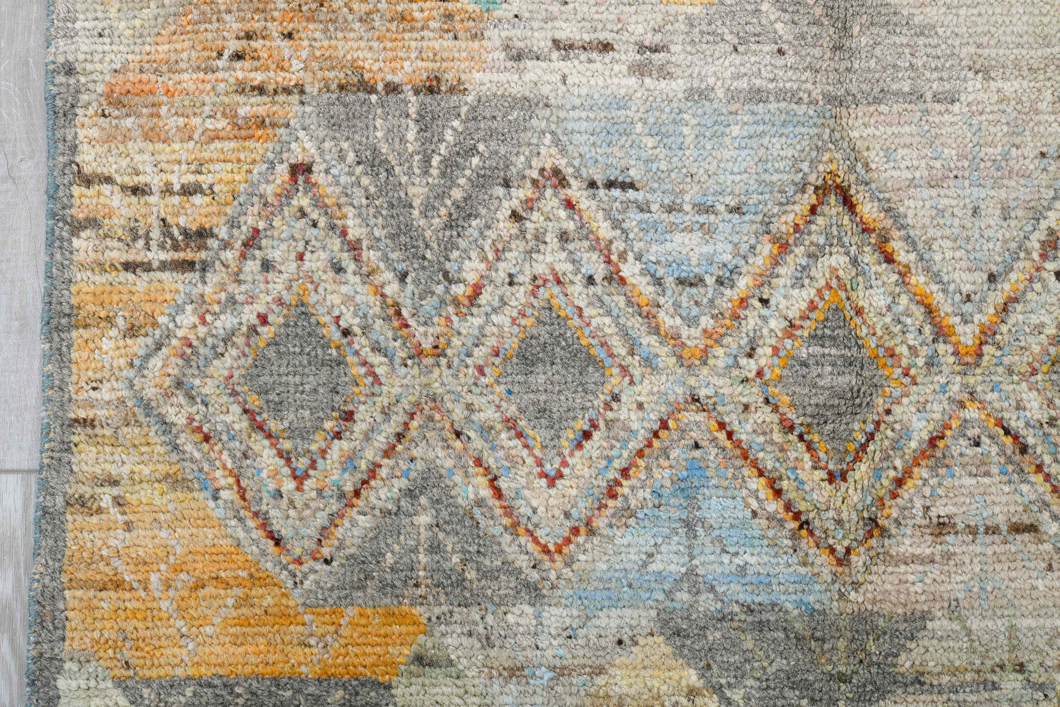 5' x 7' one-of-a-kind handmade vintage Tulu rug. Color palette: ivory, gray, terra cotta, pale blue, taupe, camel, sage