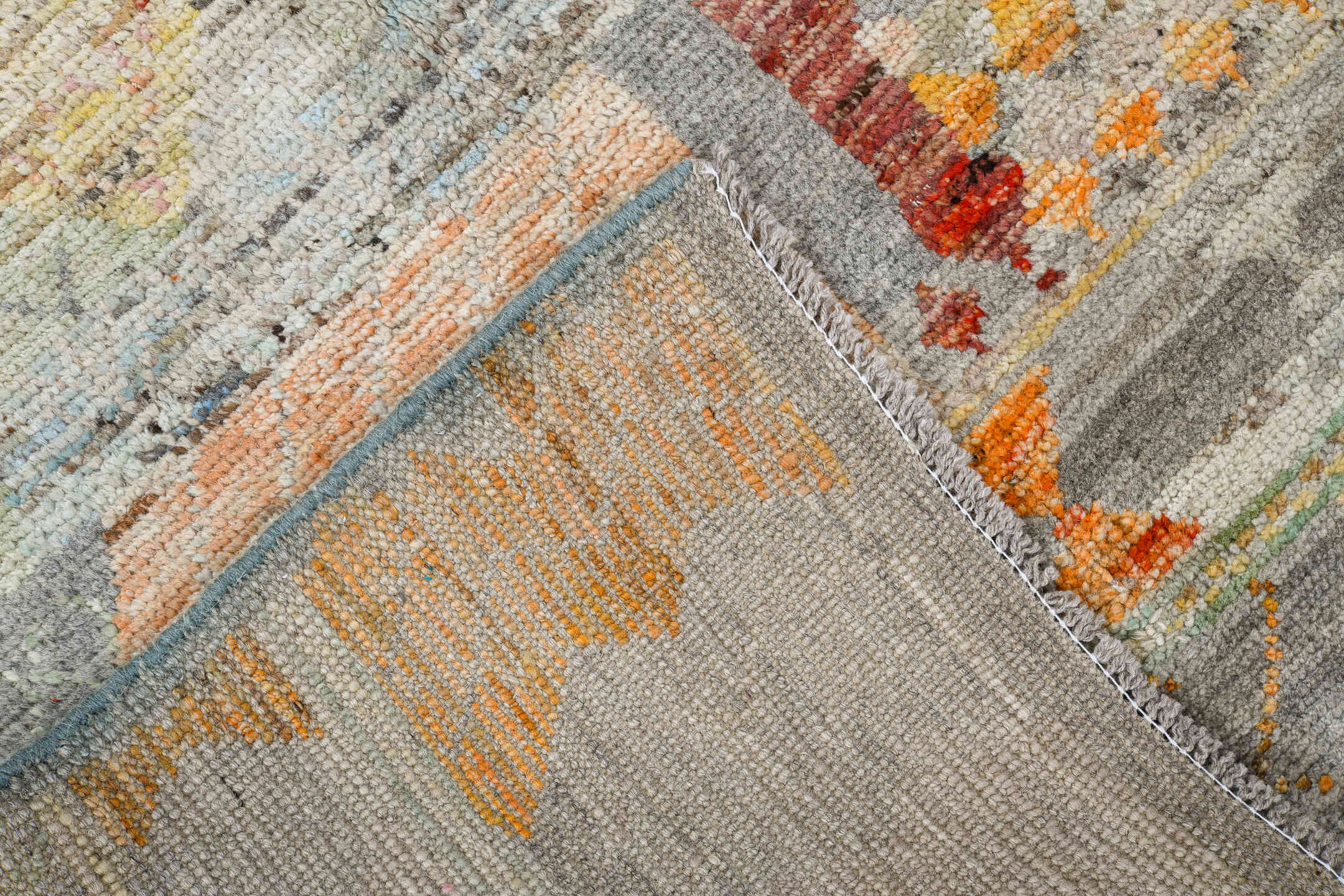 5' x 7' one-of-a-kind handmade vintage Tulu rug. Color palette: ivory, gray, terra cotta, pale blue, taupe, camel, sage