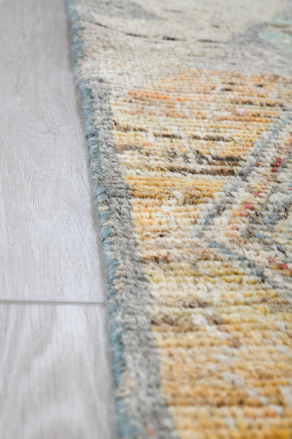 5' x 7' one-of-a-kind handmade vintage Tulu rug. Color palette: ivory, gray, terra cotta, pale blue, taupe, camel, sage