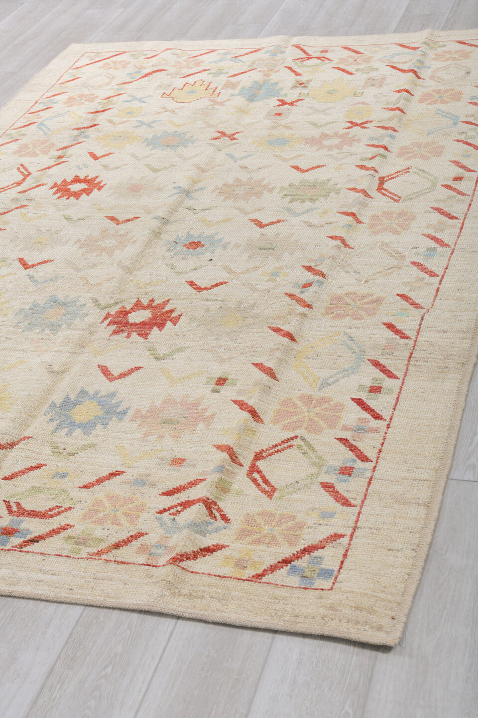 6' x 9' one-of-a-kind handmade vintage Tulu medium size rug. Color palette: ivory, rust, pale blue, blush, soft yellow, sage
